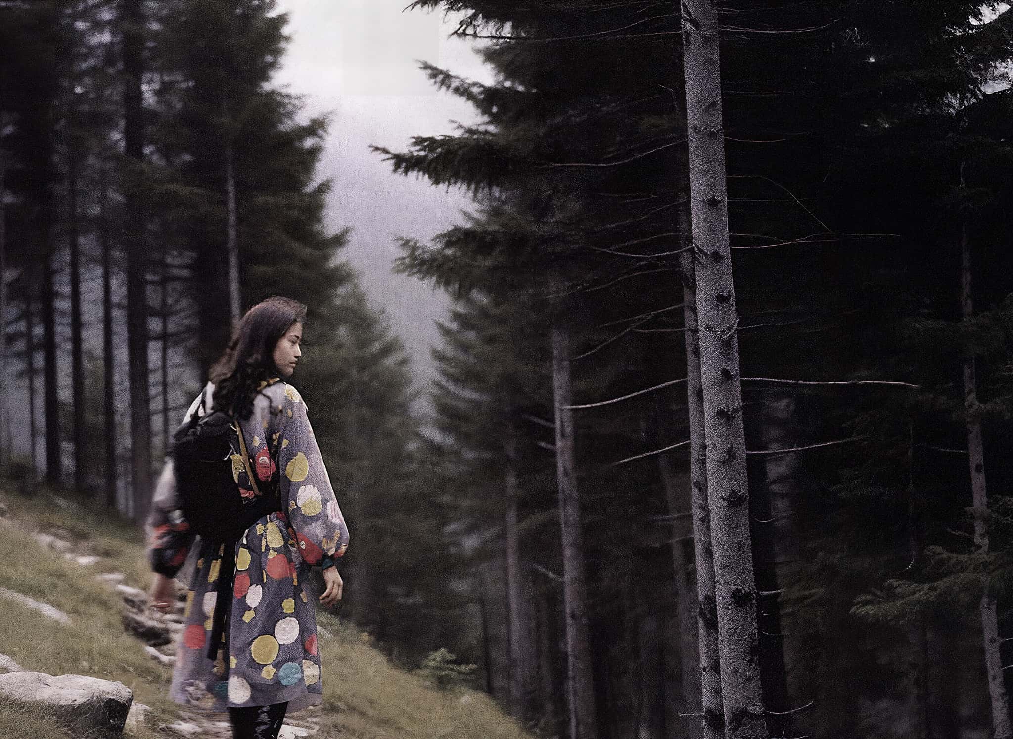 A young woman in a cinematic forest